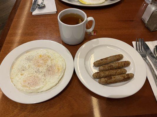 Eggs and turkey sausage with hot tea.