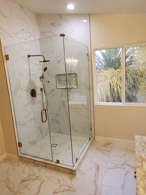 Frameless shower enclosure