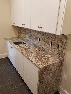 African Rainbow Granite with full backsplash and waterfall - Ashburn, VA