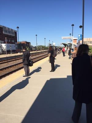 Inbound morning travelers awaiting the next train.