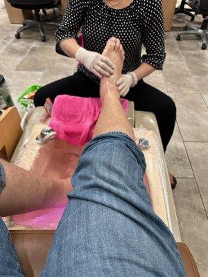 Foot, ankle and lower leg massage with pedicure.