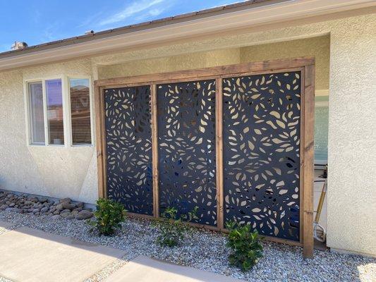 Landscape Logic designed and built this deco panel wall to screen the patio from the sun.