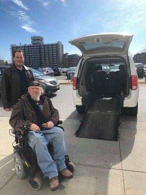 Accessible taxi cab with happy customer