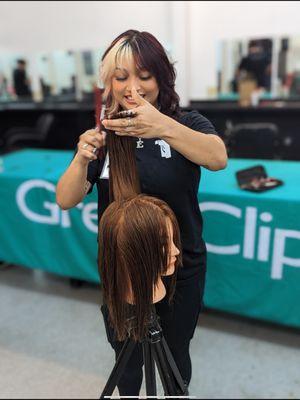 This is a Barber student learning the basics of cutting hair.