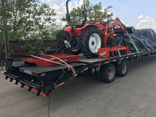 Great looking tractor on a flat bed truck!