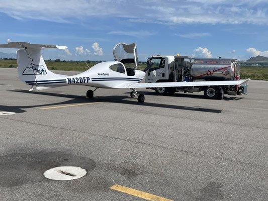 Fueling up the DA40 for more pilot training! Not me, him!