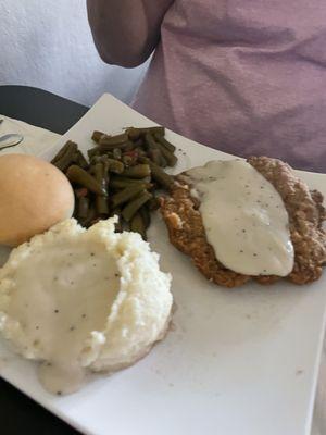 Chicken fried steak with two sides