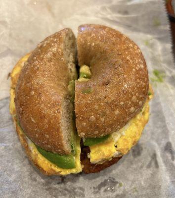 whole wheat bagel with egg, cheddar, veggie sausage, avocado