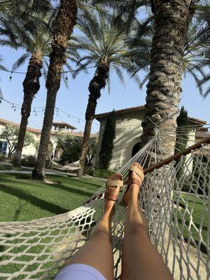 Outdoor area with hammocks and fountains