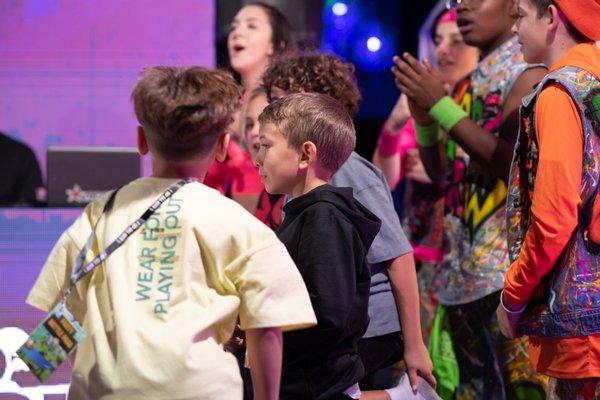 Watching the performance of children dancing