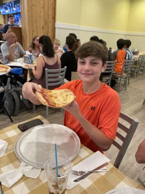 Huge slice of Pizza and my nephew