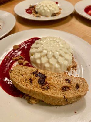 Our signature dessert: kaffir lime infused buttermilk panna cotta with currant pistachio biscotti and sour cherry coulis