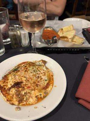 Lasagna, rose, and bread for the table came out with our food (not before)