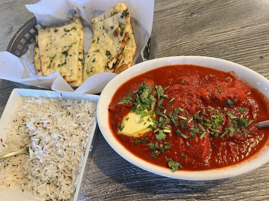 Butter chicken, jeera rice and garlic naan