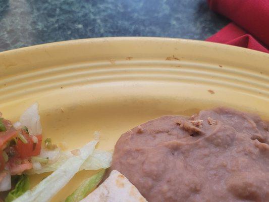 You can see the food that's caked on the plate that the machine probably could scrub off.