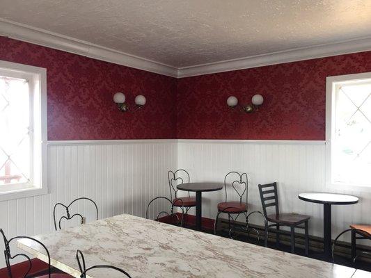 Old timey ice cream parlor with velvet wallpaper.