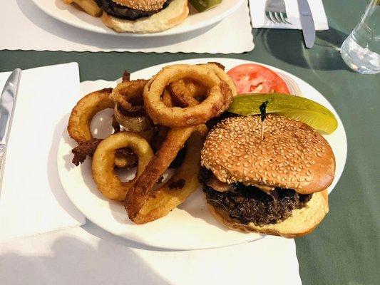 Burger with BLT and pickle with Onion Rings