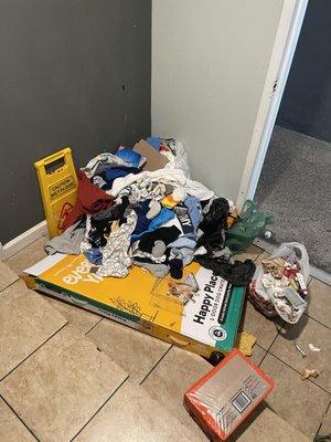 Disgusting and dirty trash room.