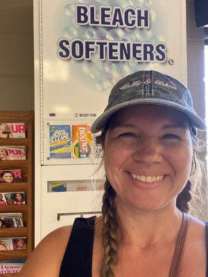 Coin-op soap dispenser. Also the fake smile of a woman not desiring to do gross laundry on vacation.