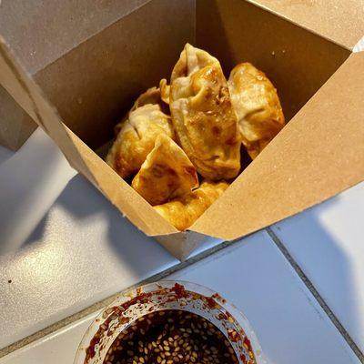 Chicken dumplings, 8-pieces, fried, with tangy sauce, $6