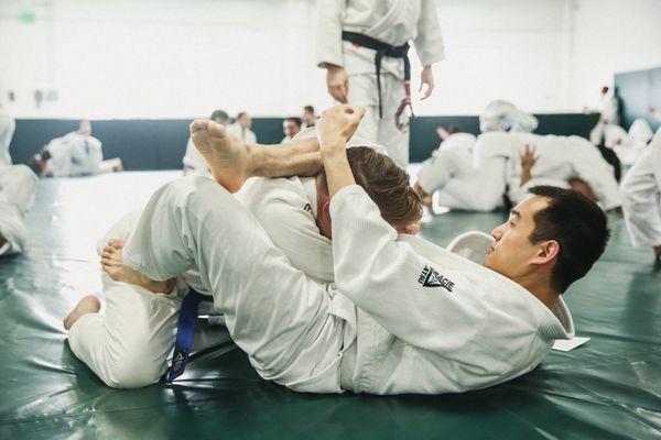 Jiu jitsu students learning self-defense