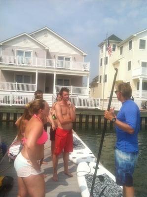 Master SUP Instructor and US SUP Champion, Tom O'Brien, running class at our private dock in Smugglers Cove.