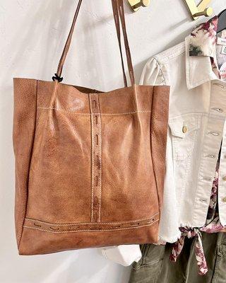 Who says you can't wear floral in fall? These muted rosy and olive tones look great with this leather bag!