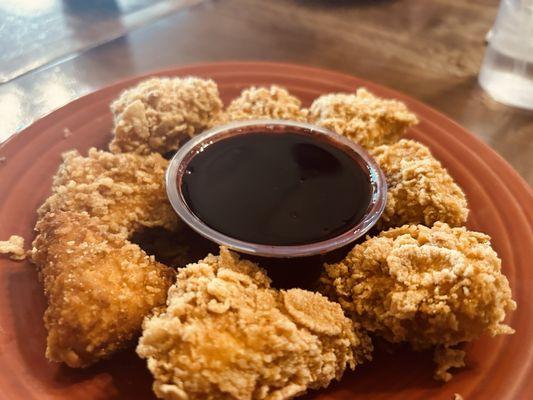 Cheese fried in corn flakes with yummy blueberry sauce