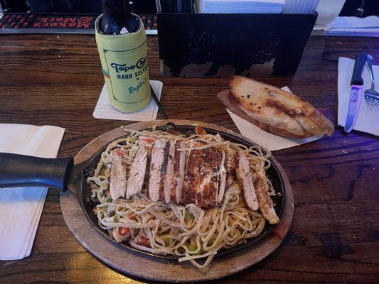 Blackened Chicken Pasta. Angel hair pasta and two pieces of bread.  Plenty for two people or save some for lunch tomorrow.