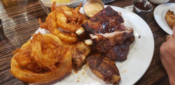 3 meats dinner..wings, ribs, and brisket.   Beear battered onion rings are the Bomb!