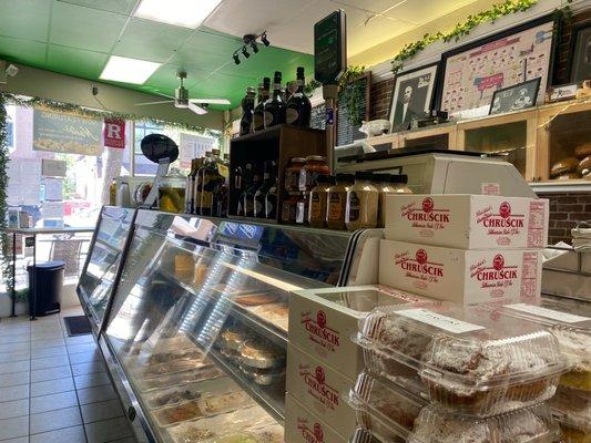 Deli cases, specialty imported groceries and fresh pastries.