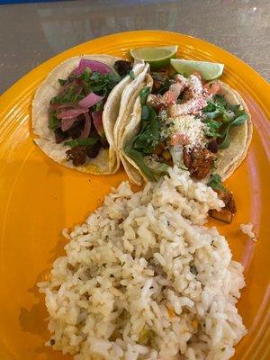 Lunch special. 1 grilled chicken and 1 grilled steak taco. Cilantro lime rice and not shown was a cup of chicken tortilla soup.