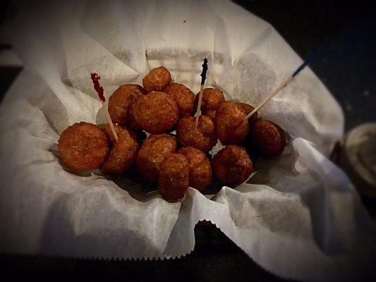 SHROOMS: A basket of fresh white mushrooms with a light breading formulated to fry up crispy on the outside and juicy on the inside.