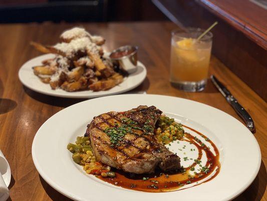 12 oz Patchwork Pork rib Chop with bourbon glaze, Parm fries, and to drink was the "It's Never Too Early" bourbon cocktail.