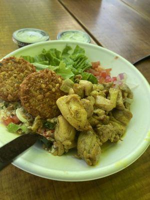 Chicken shawarma and falafel bowl.  Served on tabulah and hummus