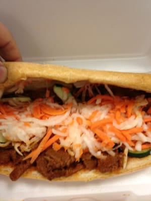 Inside spicy pork grinder.