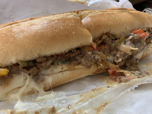 Philly cheesesteak  Onions peppers extra cheese and wine sauce