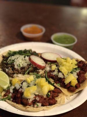 Finally a place that puts pineapple on the al pastor tacos! There is also one taco de carne asada on the plate.