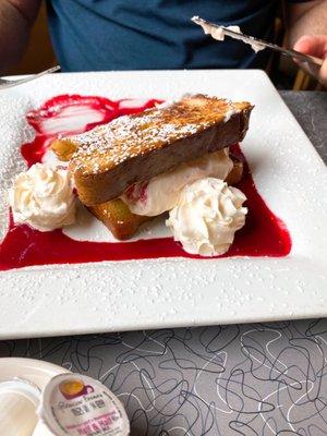 Ricotta cheese French Toast Ricotta cheese, raspberry, almond extract with whipped cream and raspberry sauce.