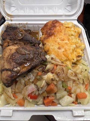 Stew chicken and 2 sides lunch special- cabbage and Mac and cheese.