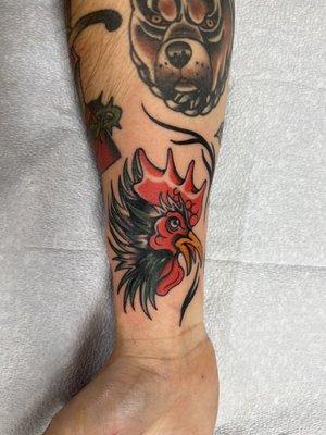 Rooster and flames filler were draw right on then tattooed