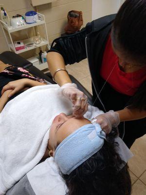 Eyebrow threading pic.