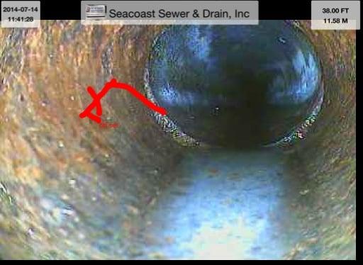 Sewer Video Camera - Snap Shot of Sewer Line (red mark indicates damaged area / off set of pipe)