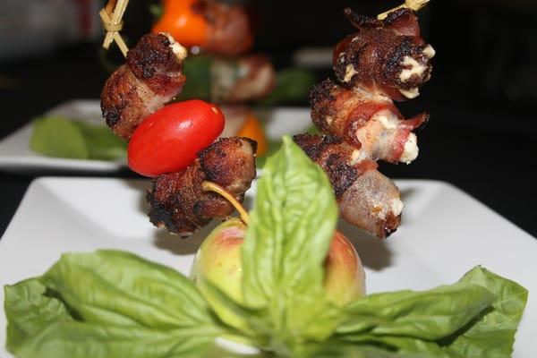 Goat cheese filled dates wrapped with bacon and wood fired. delicious app