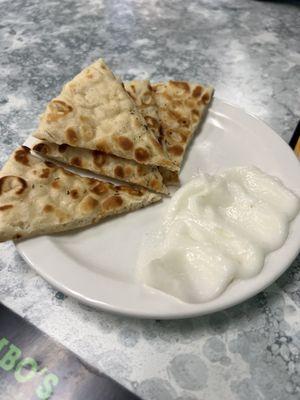 Complimentary pita and garlic sauce