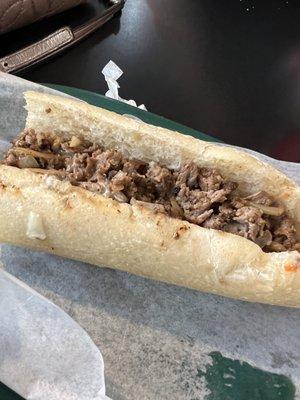 Cheesesteak with fried onions and ketchup