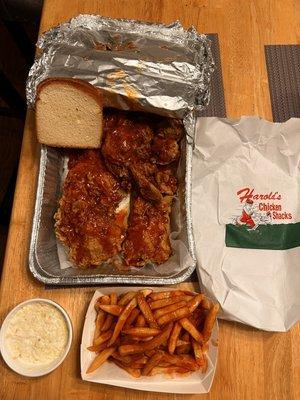 8-Piece Mixed Chicken Bucket with fries drenched in mild sauce. Side of cole slaw.