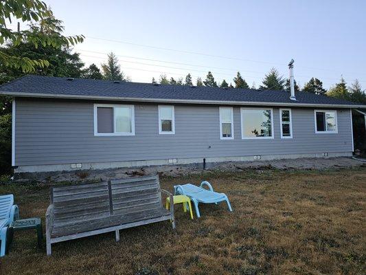 What a difference! New windows, new Hardie Plank cedar mill lap siding, fresh paint job using Sherwin Williams paint.