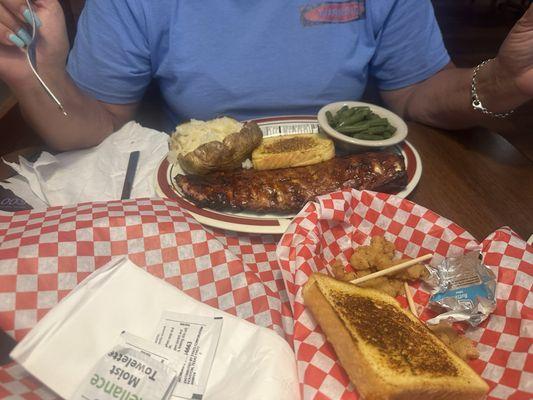 Full rack of baby back ribs, green beans the wife loves the green beans and baked potato.