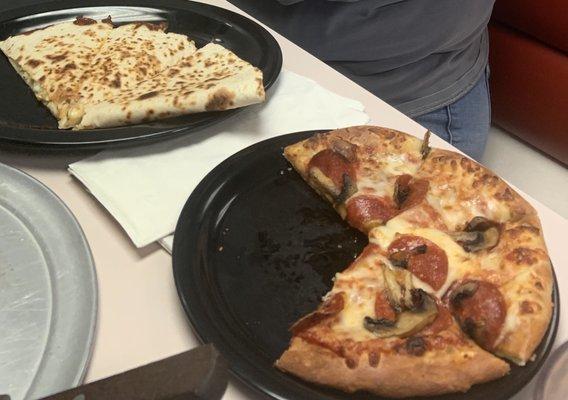 Chicken quesadilla and pepperoni and mushroom pizza